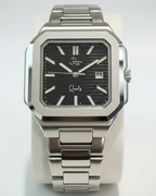 Silver watch with black face on a light gray background